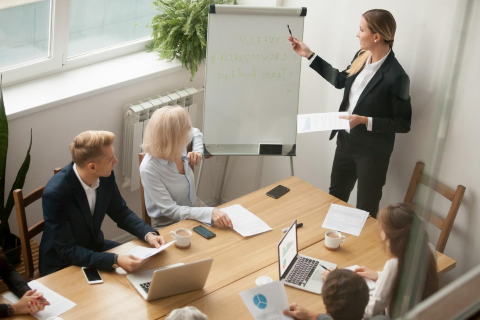 Small business owner reviewing financial documents in modern office setting