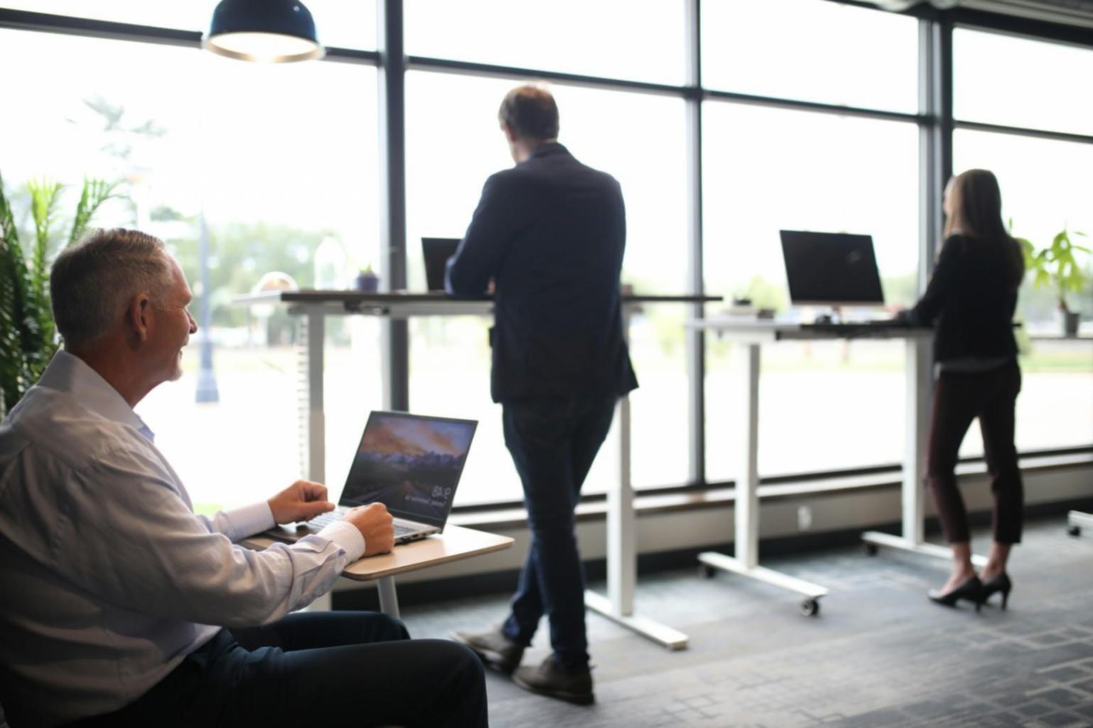 Clean organized workspace with financial documents and calculator ready for business planning