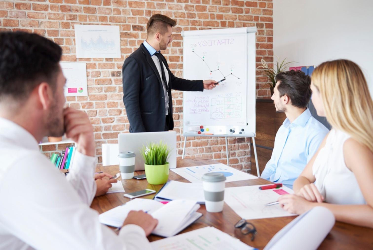 Students working together on financial planning exercises in a collaborative learning environment